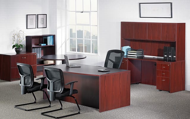 traditional office space with credenza, table, and cabinets for storage