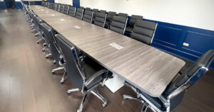 40' Conference Table with Power Inserts, Cube Base with Access Doors for Wire Management, Executive Conference Chairs with Chrome Base, Black Leather Upholstery, Matching Side Chairs